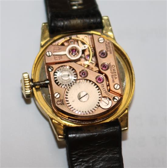 A ladys 1950s 18ct gold Omega manual wind wrist watch.